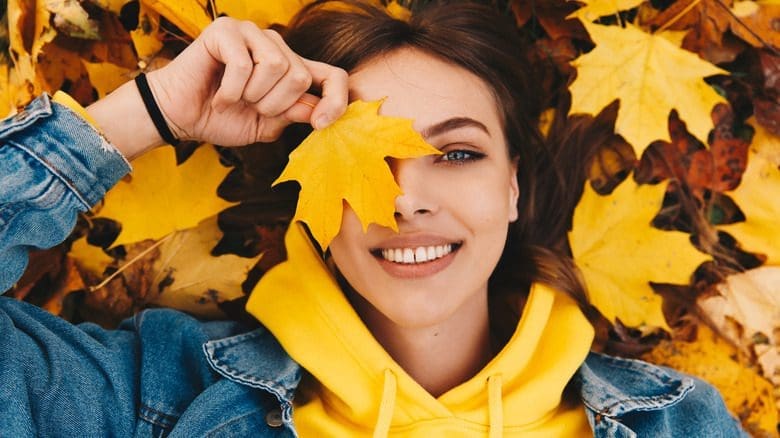 Autumn,Portrait.,Happy,Girl,In,Yellow,Hoodie,And,Jean,Jacket, skin care products for fall